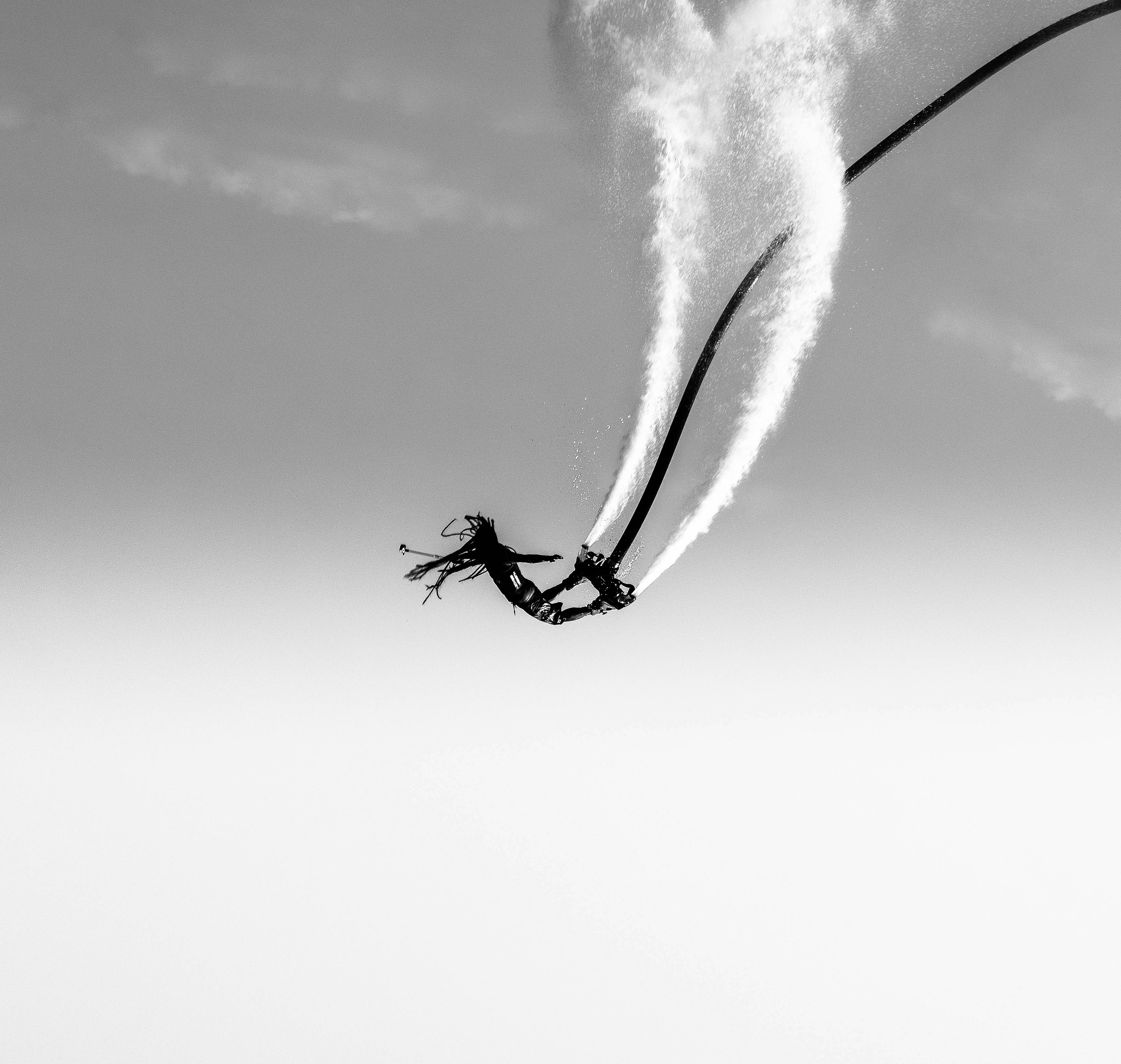 Fly high. by Hoverboarding grayscale photography of person doing stunt on air