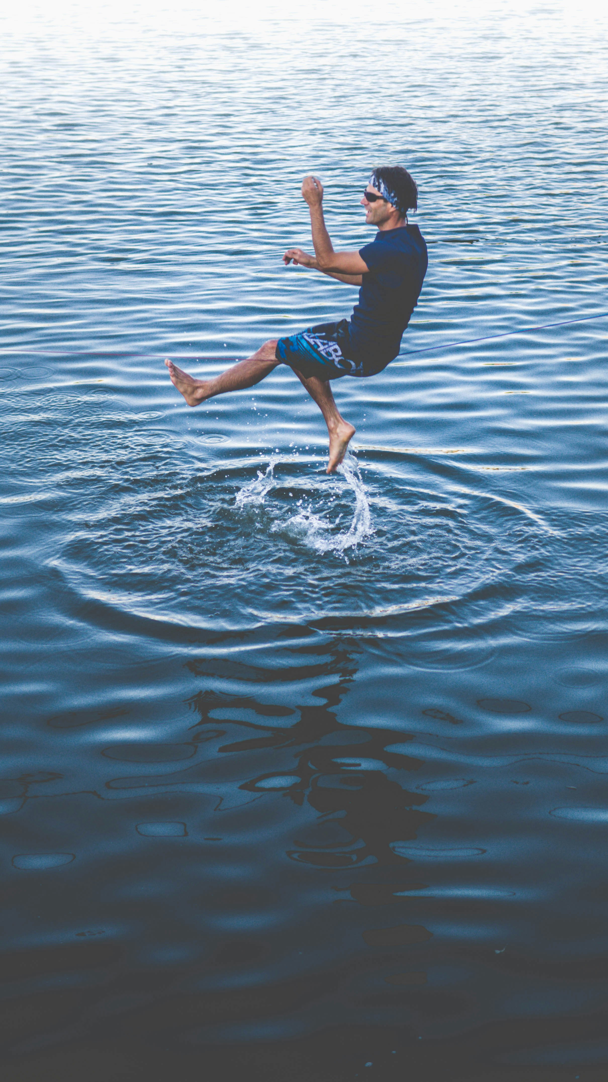 Walking on the water by Hoverboarding panning photograph of man on water